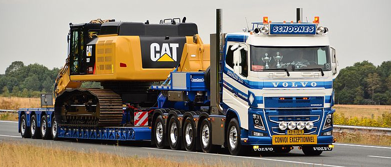 Heavy Cargo Transport by Flow Logistics